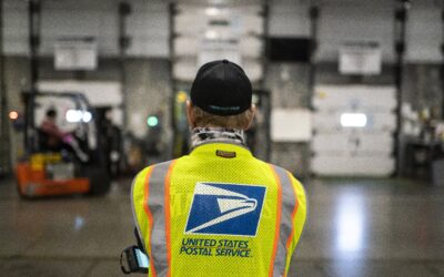 A judge expands a block on U.S. Postal Service work on Trump's mail-in voting order